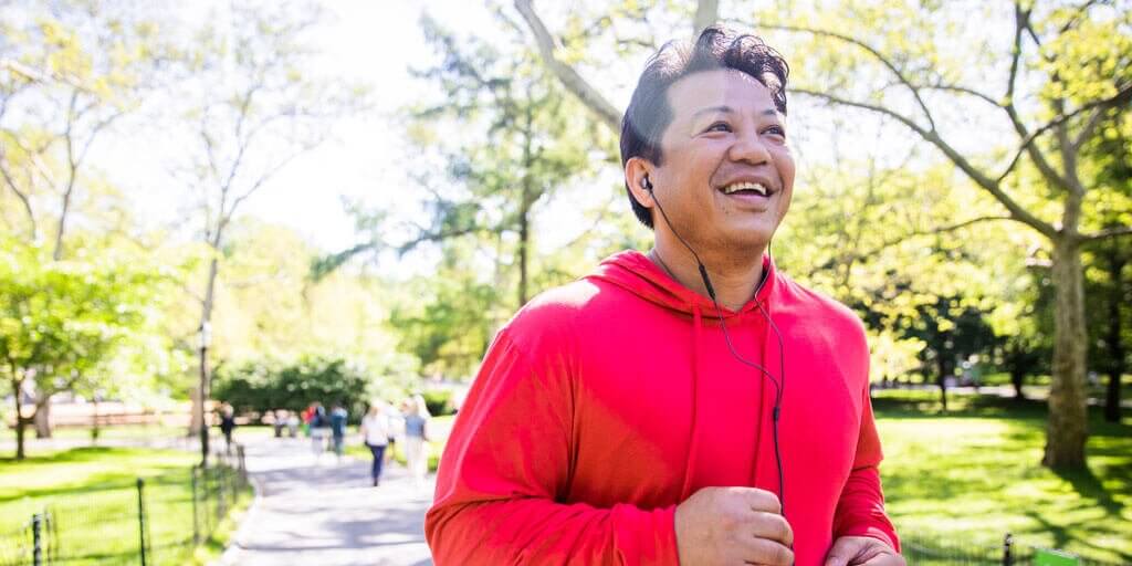 Blog - Can I Have LASIK A middle-aged man is running outdoors without the need for eyeglasses or contacts.