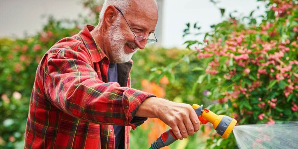 symptoms-of-diabetic-retinopathy-1024x512 Senior man outdoors watering his yard and plants.